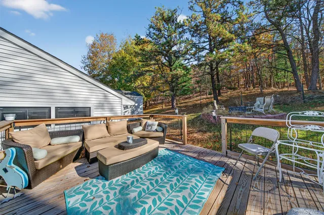 a patio with patio a couch and wooden floor