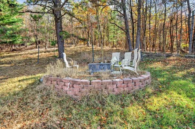 a swimming pool with trees in front of it