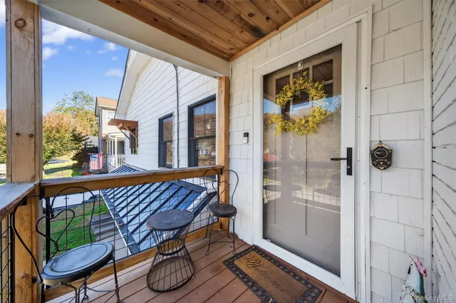 a view of a balcony with furniture