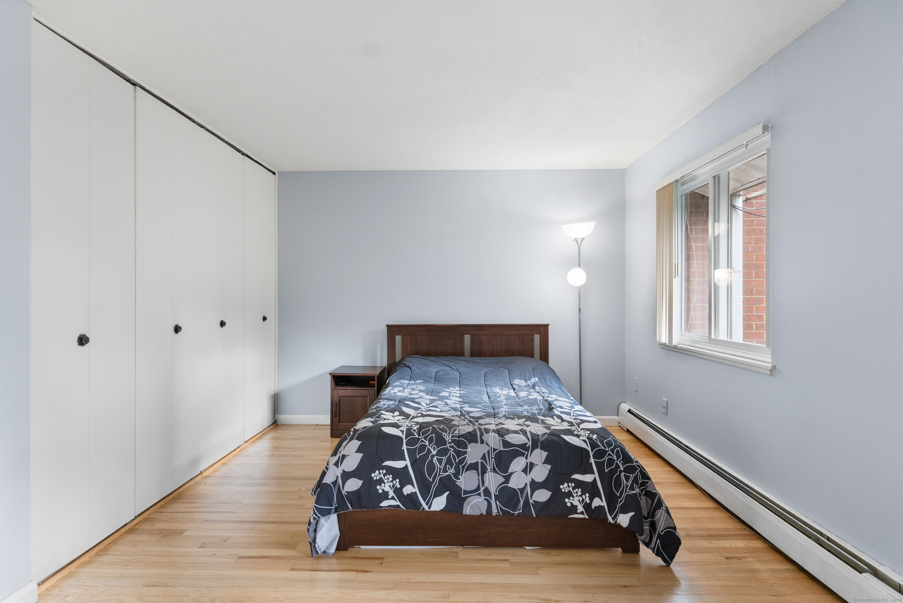 248 Centerbrook Road Hamden, CT 06518 - Photo 15 of 30 a bed sitting in a bedroom next to a window