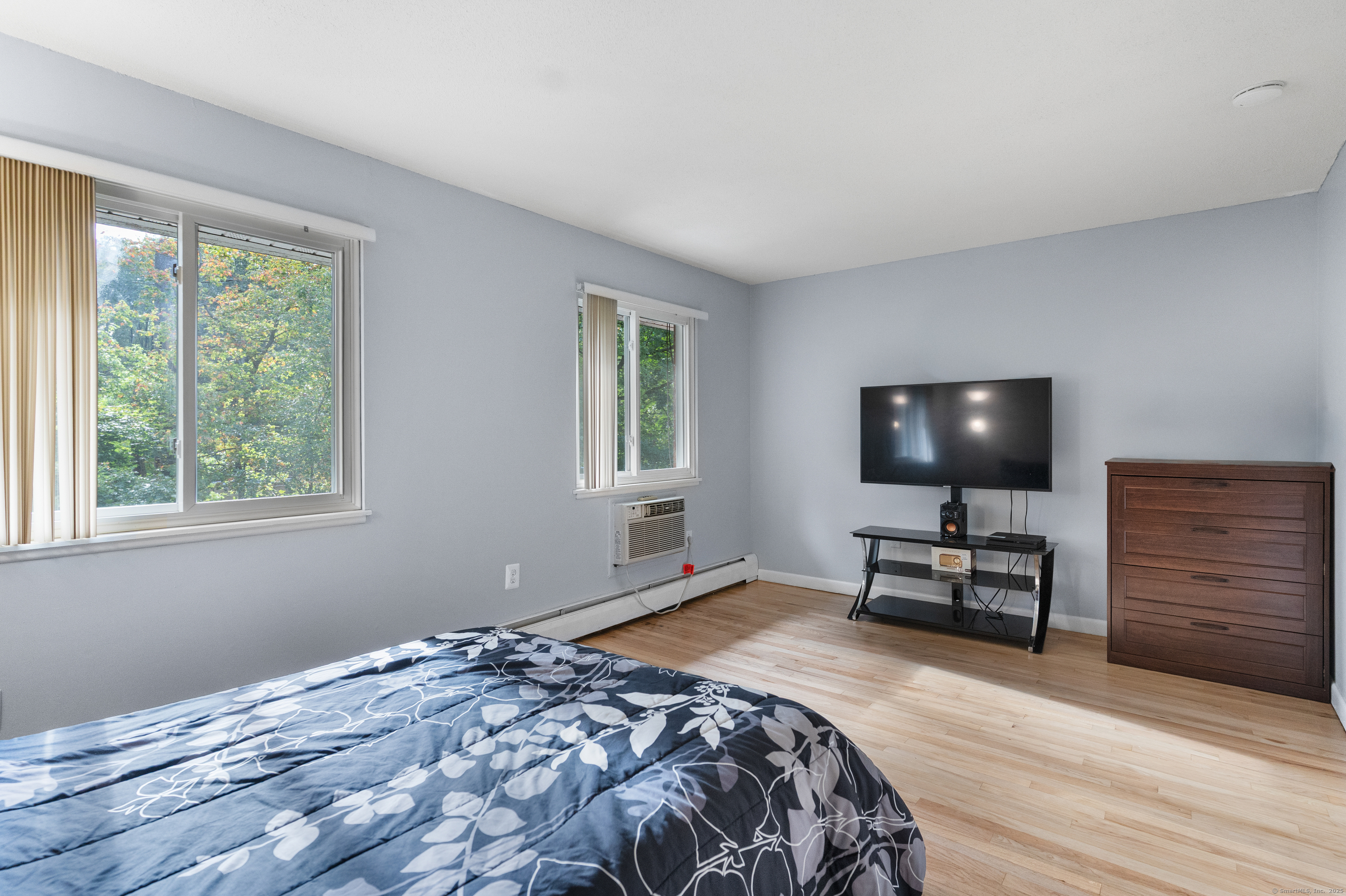 248 Centerbrook Road Hamden, CT 06518 - Photo 16 of 30 a bedroom with a bed and a flat screen tv