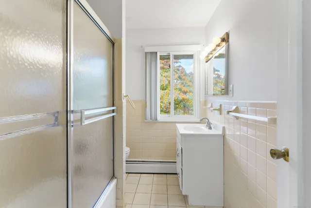 a bathroom with a bathtub and a sink