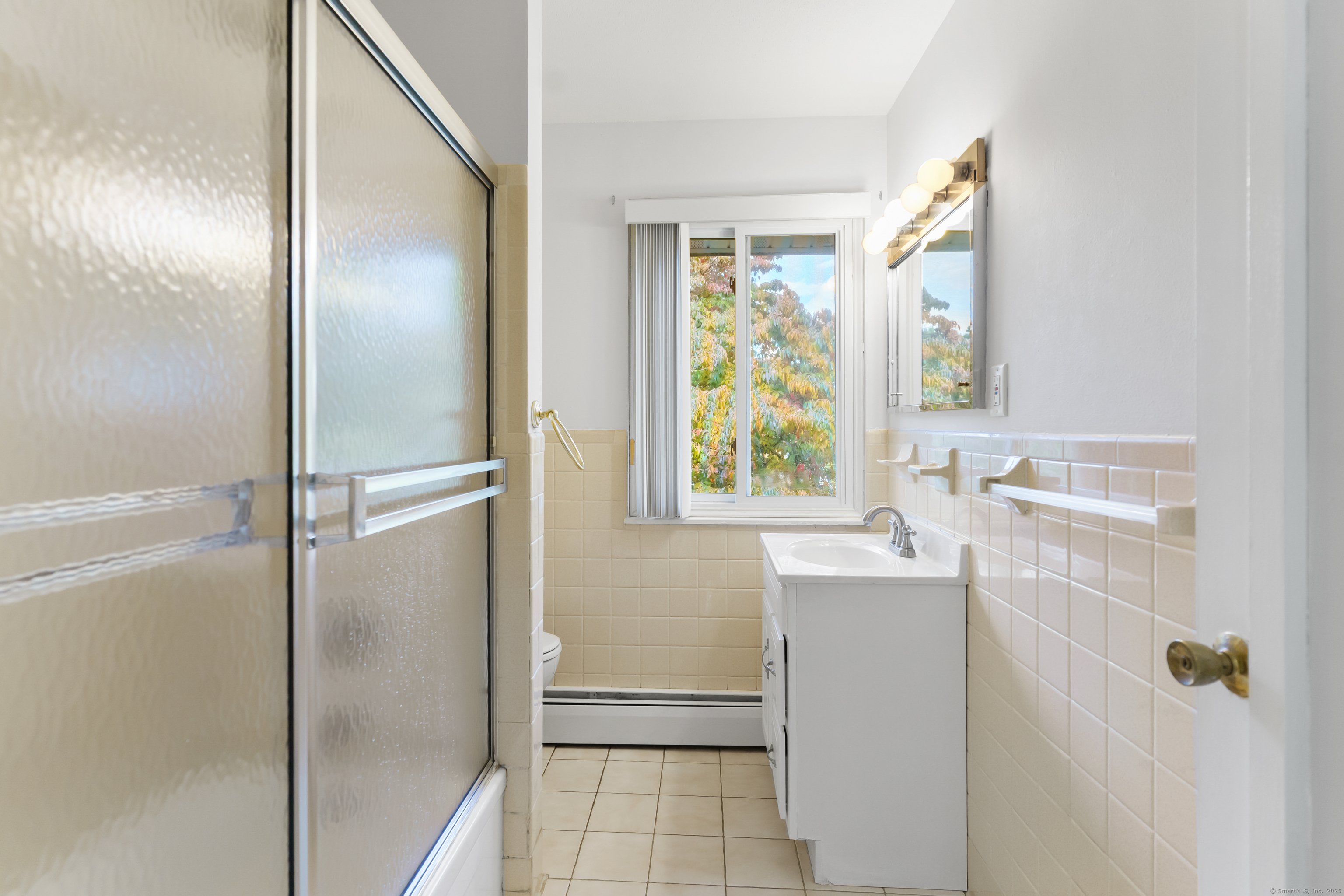 248 Centerbrook Road Hamden, CT 06518 - Photo 17 of 30 a bathroom with a sink and a mirror