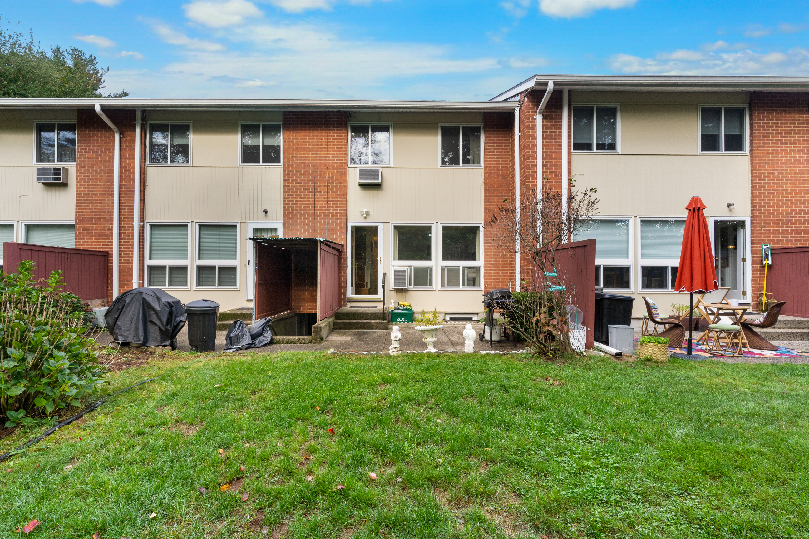 248 Centerbrook Road Hamden, CT 06518 - Photo 24 of 30 a view of a house with a yard and sitting area