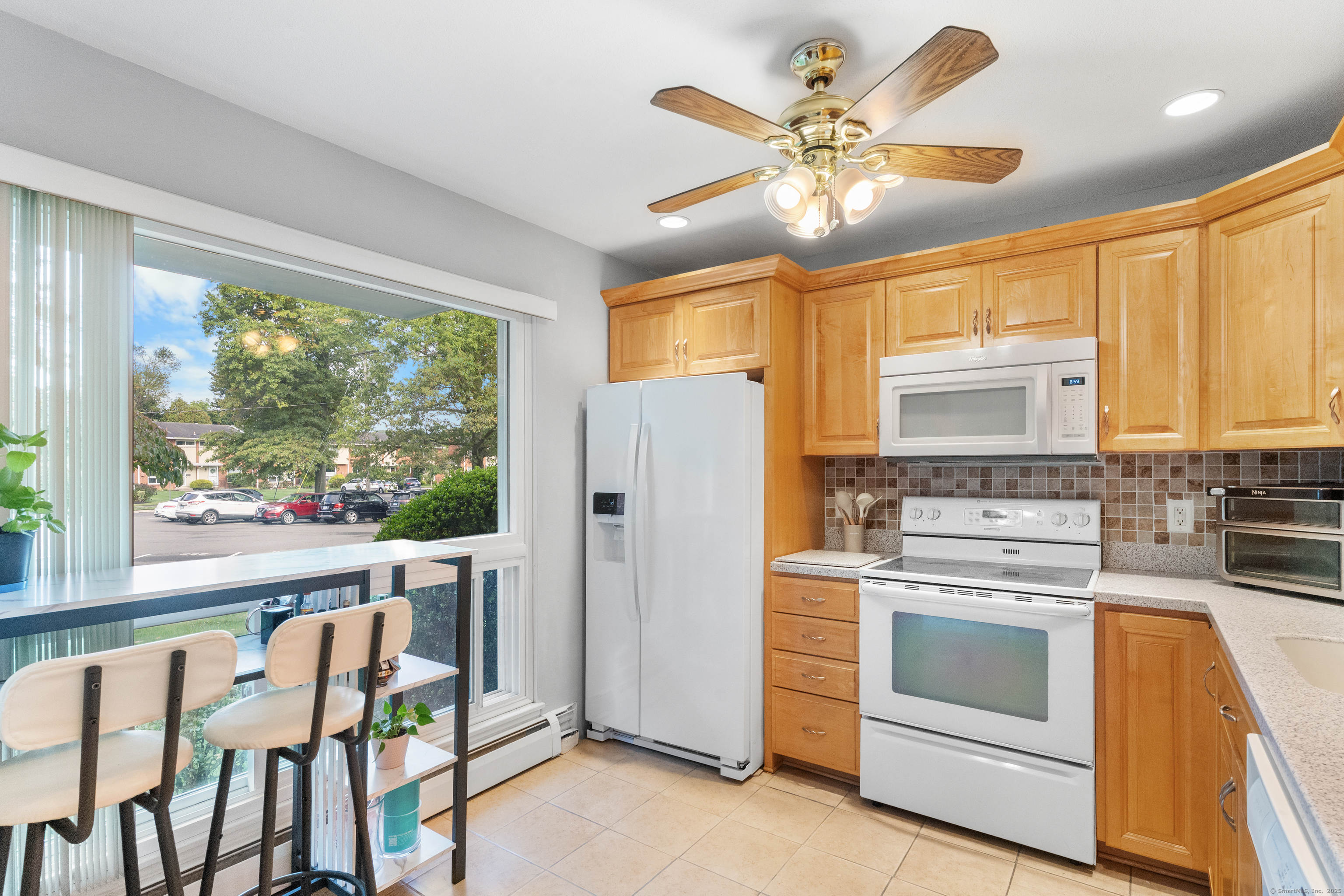 248 Centerbrook Road Hamden, CT 06518 - Photo 3 of 30 a kitchen that has a stove and a refrigerator