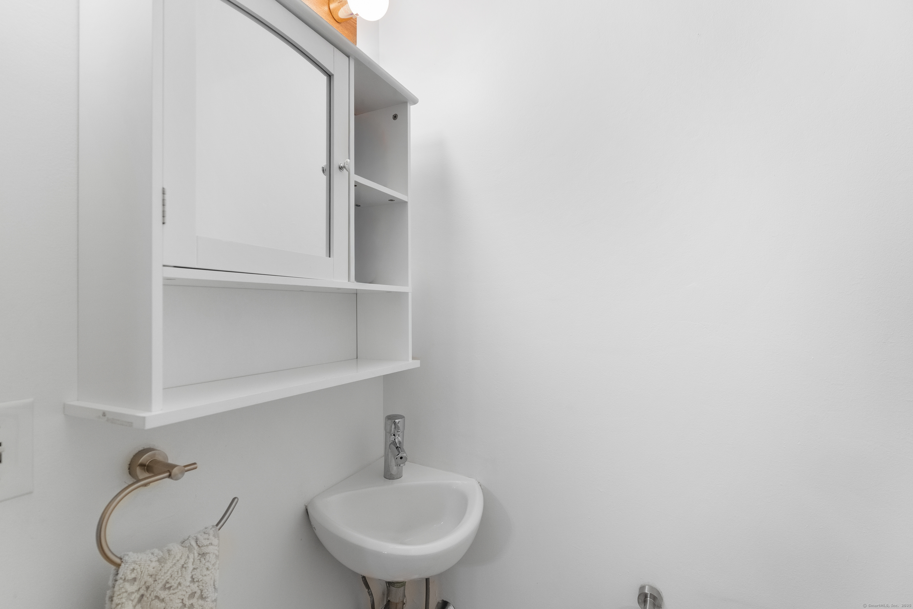 248 Centerbrook Road Hamden, CT 06518 - Photo 6 of 30 a bathroom with a sink and a mirror