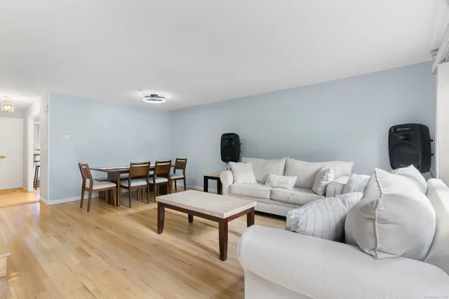 a living room with furniture and a table