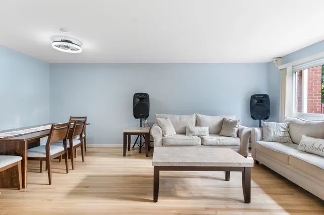 a living room with furniture and window