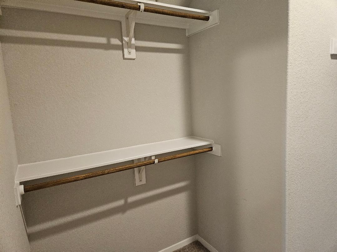 162 Hayloft Lane Elgin, TX 78621 - Photo 11 of 26 a close up view of racks on the wall