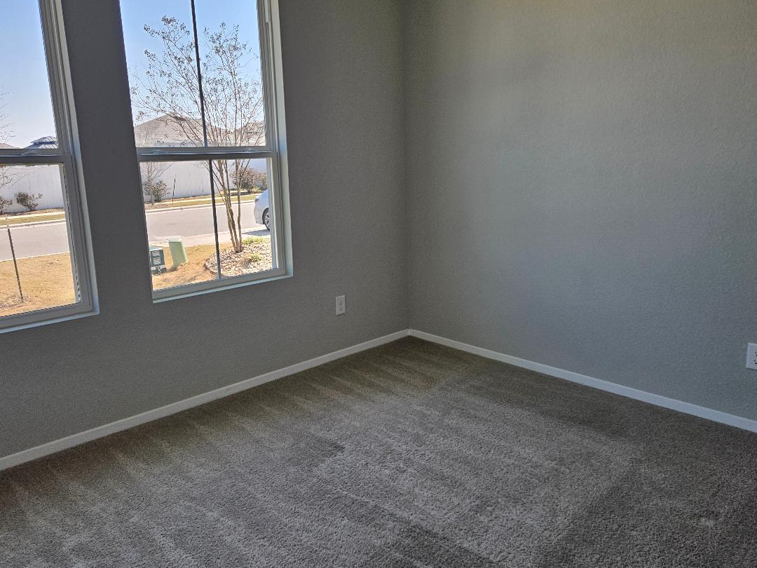 162 Hayloft Lane Elgin, TX 78621 - Photo 12 of 26 an empty room with a window