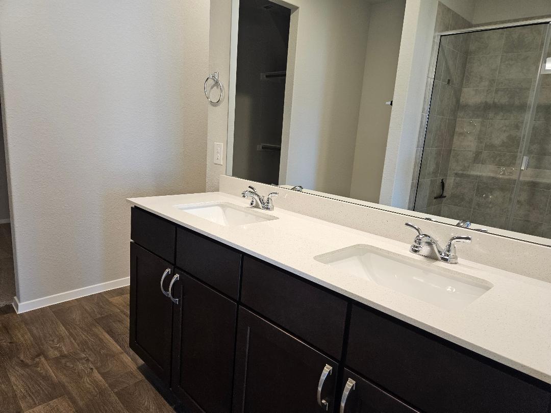 162 Hayloft Lane Elgin, TX 78621 - Photo 8 of 26 a bathroom with a sink and a mirror