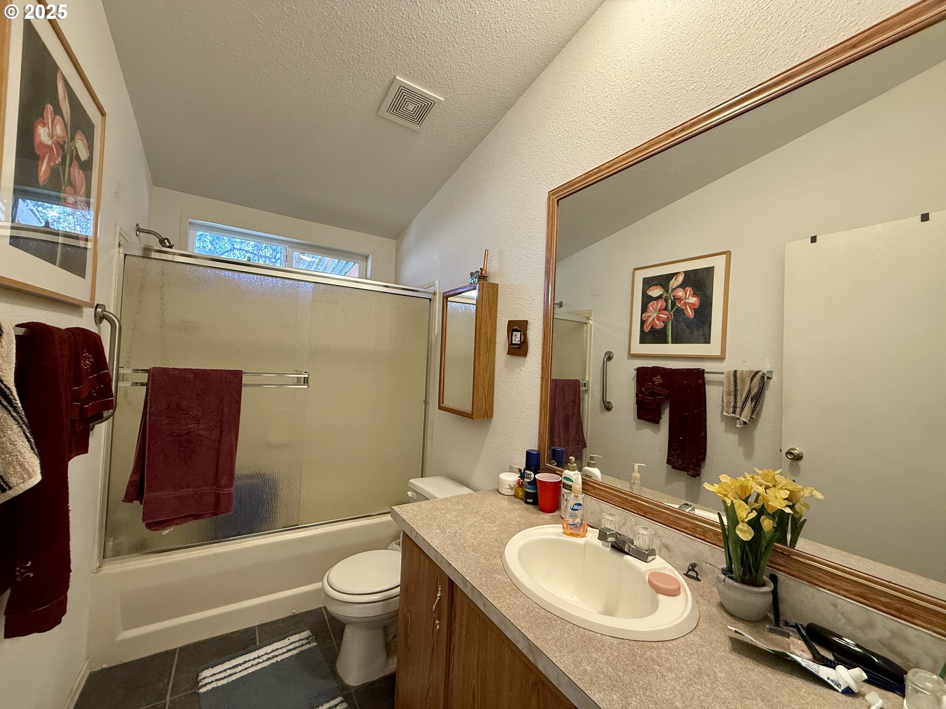 1305 Kristi Loop Lakeside, OR 97449 - Photo 21 of 25 a bathroom with a sink toilet and shower