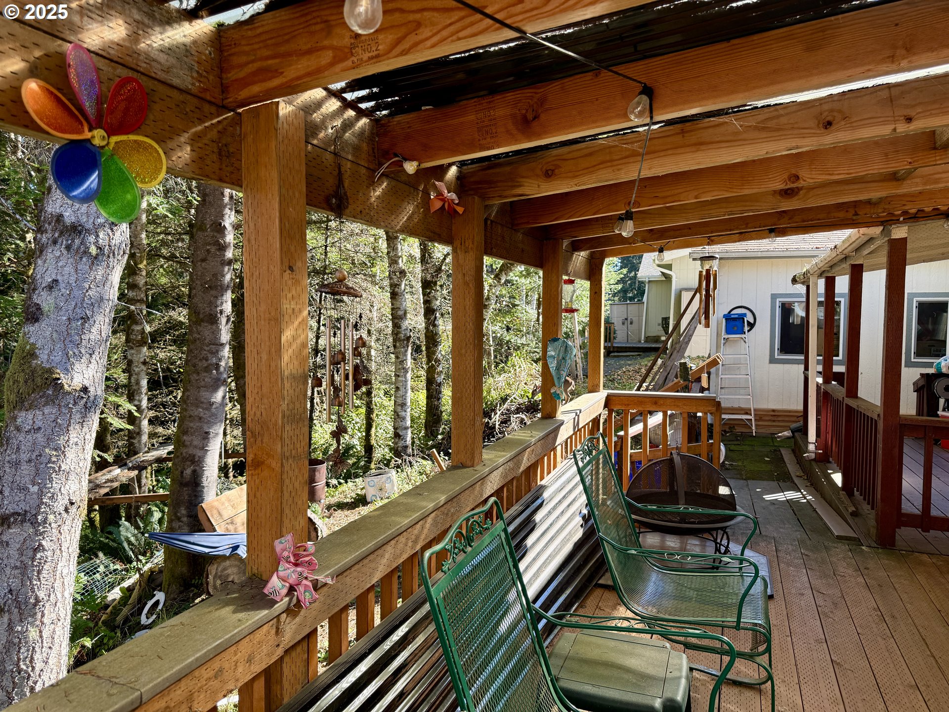 1305 Kristi Loop Lakeside, OR 97449 - Photo 25 of 25 a view of a chairs and table in a patio