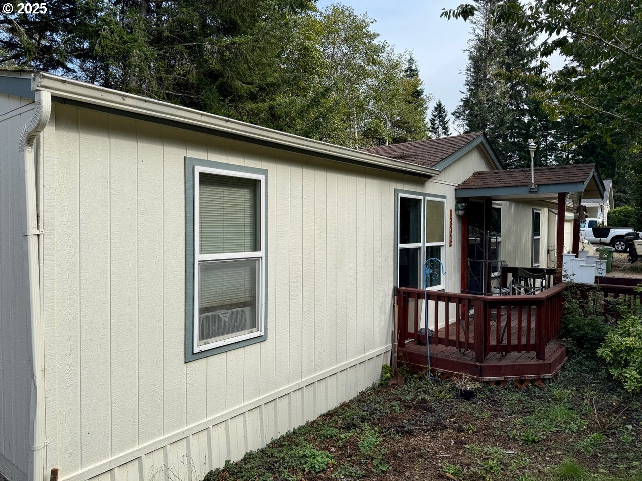 1305 Kristi Loop Lakeside, OR 97449 - Photo 7 of 25 a view of a house with porch and a yard