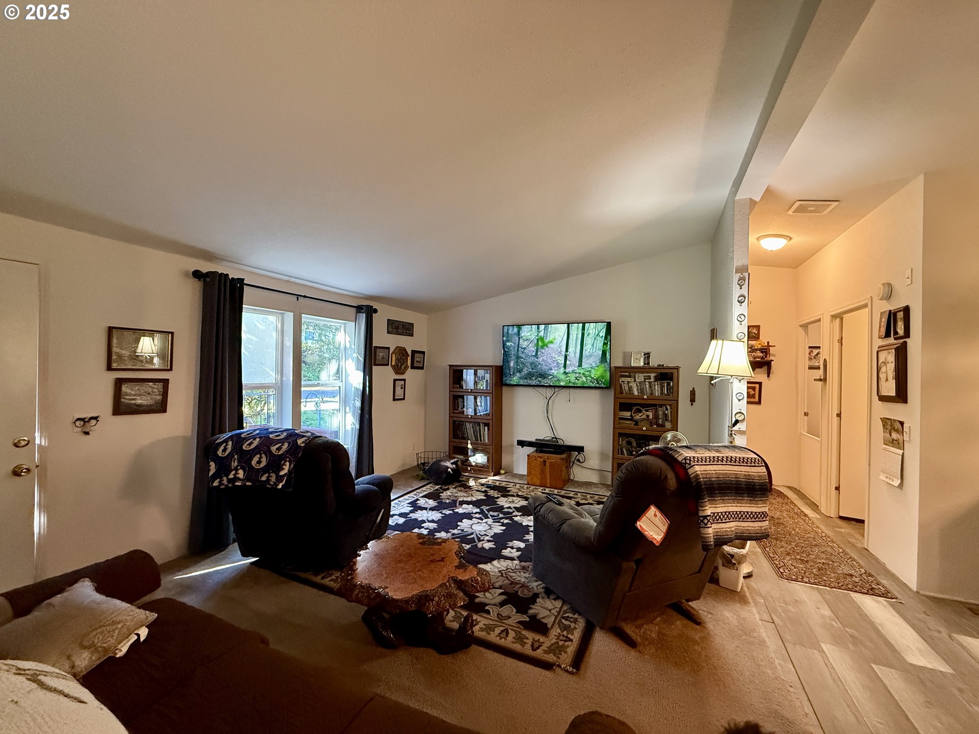 1305 Kristi Loop Lakeside, OR 97449 - Photo 9 of 25 a living room with furniture and a large window