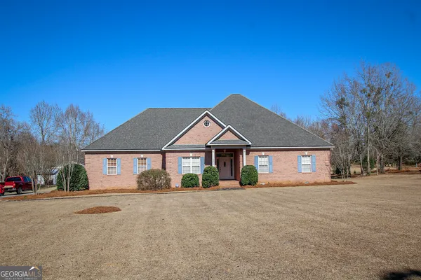 front view of a house next to a yard