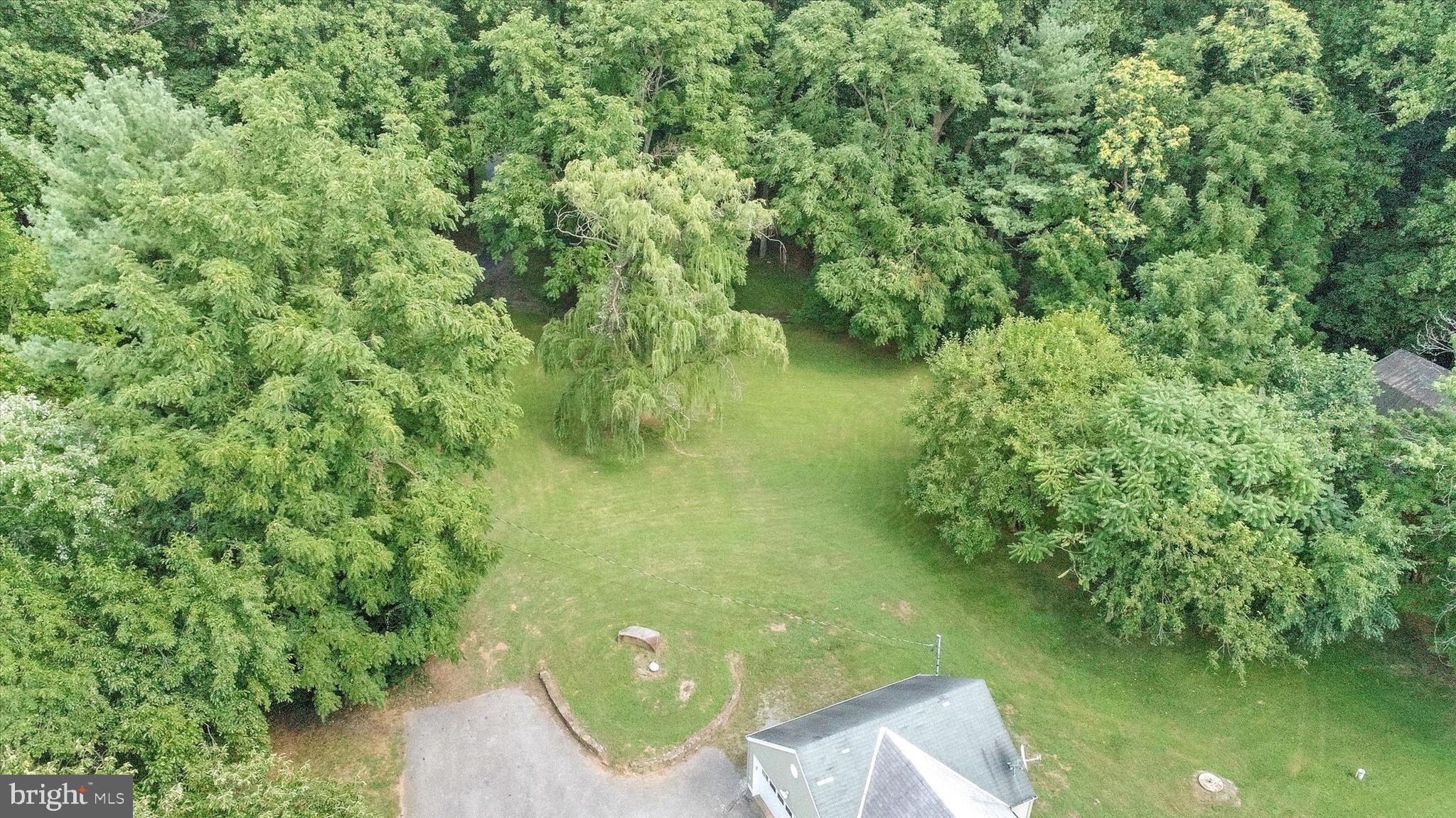 6953 Linganore Road Frederick, MD 21701 - Photo 42 of 42 Parking pad & part of the lot - beautifully green.