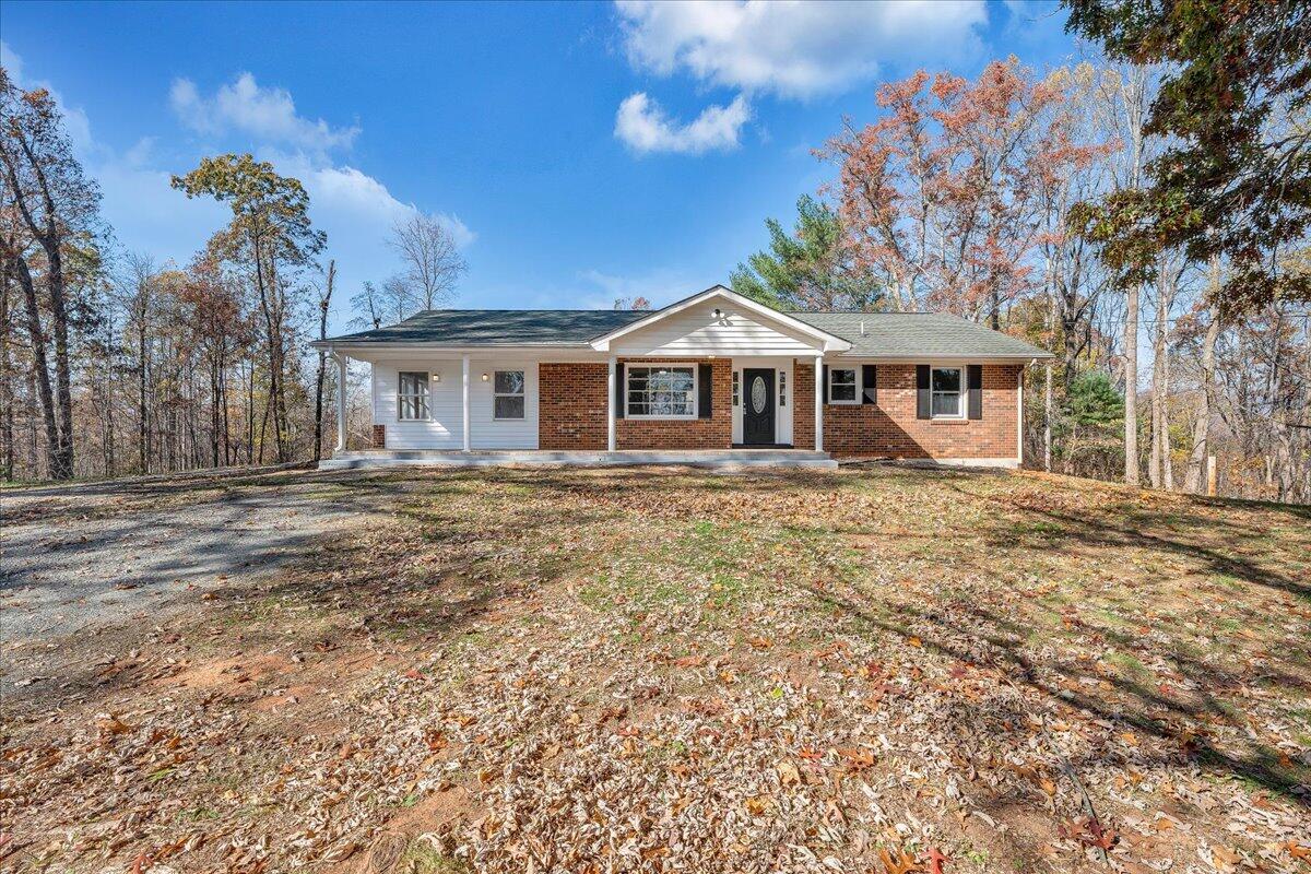 2353 Thompson Ridge Road Ferrum, VA 24088 - Photo 33 of 46 a front view of a house with a garden