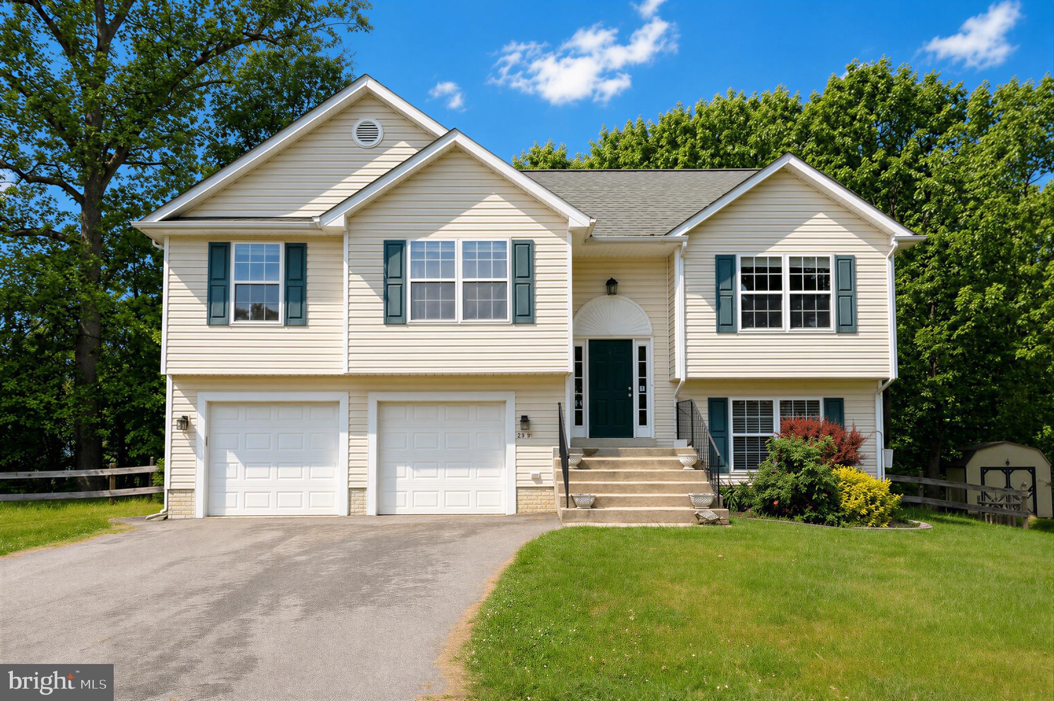 23801 McIntosh Road Hollywood, MD 20636 - Photo 35 of 35 a front view of a house with a yard and garage