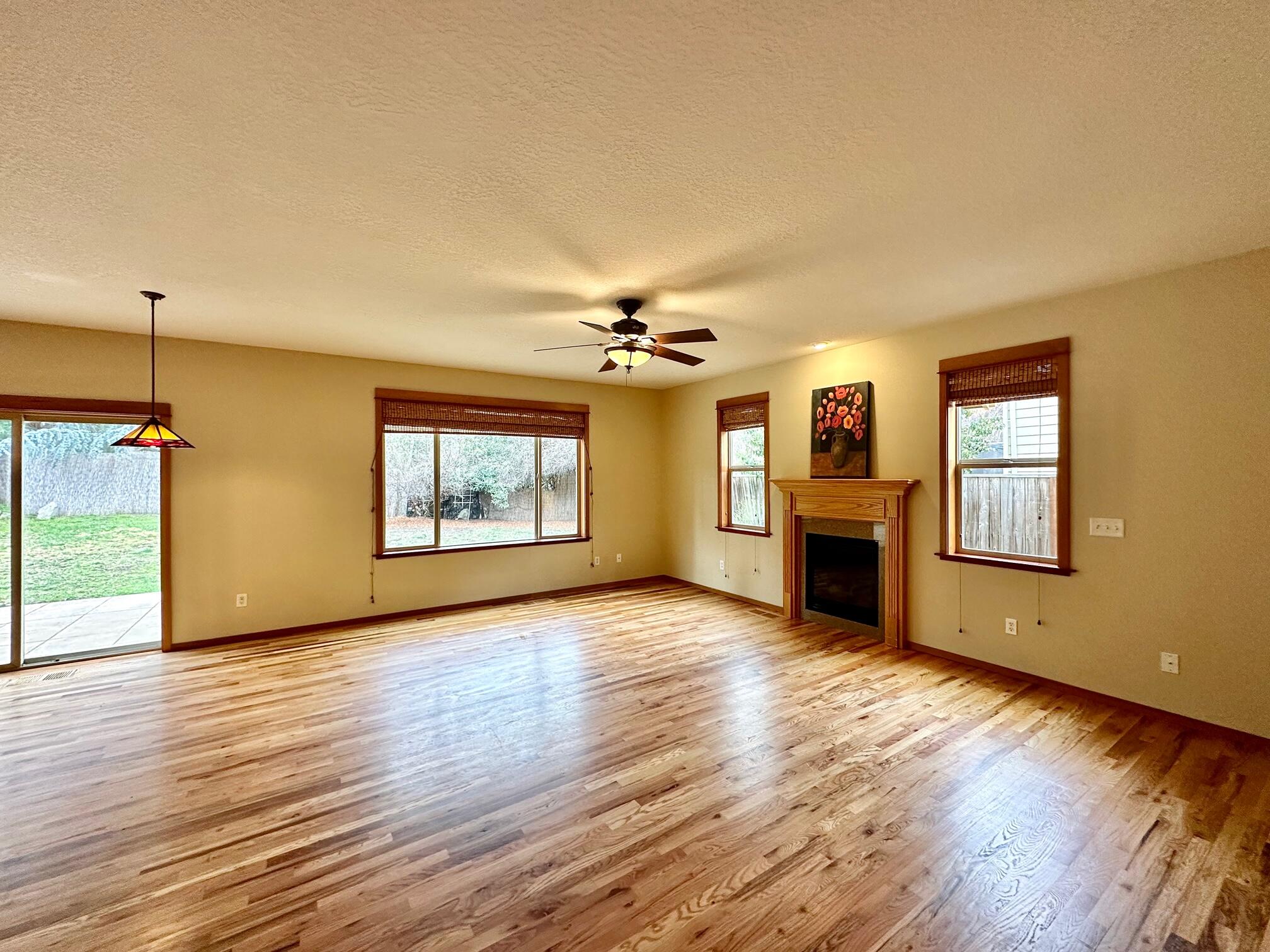 133 Max Loop Talent, OR 97540 - Photo 3 of 55 a view of an empty room with window and wooden floor