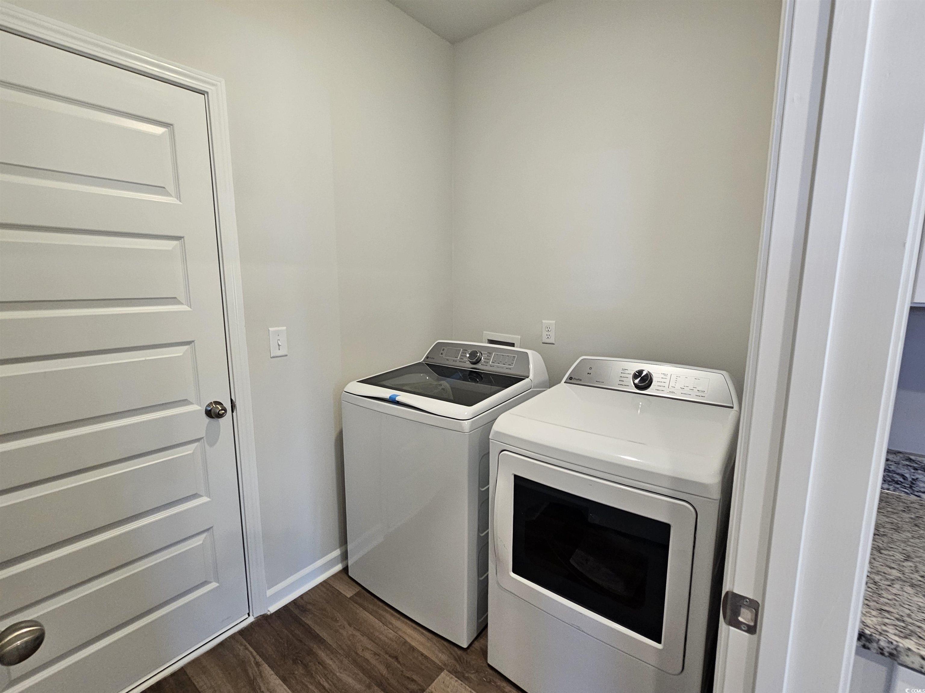 800 Wapama Street Little River, SC 29566 - Photo 12 of 34 Laundry room featuring dark wood-style floors and washing machine and clothes dryer