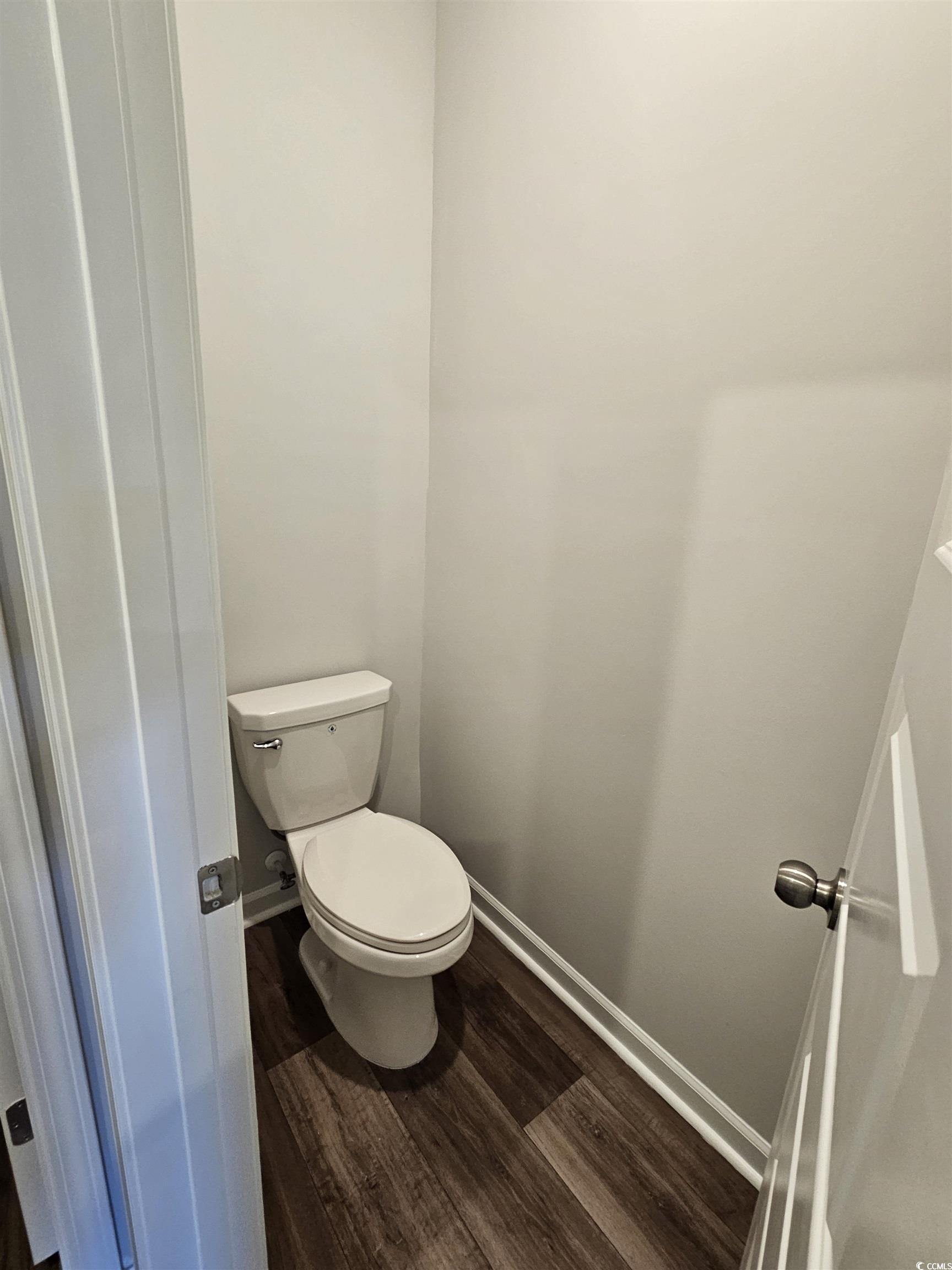 800 Wapama Street Little River, SC 29566 - Photo 14 of 34 Bathroom with dark wood finished floors and baseboards