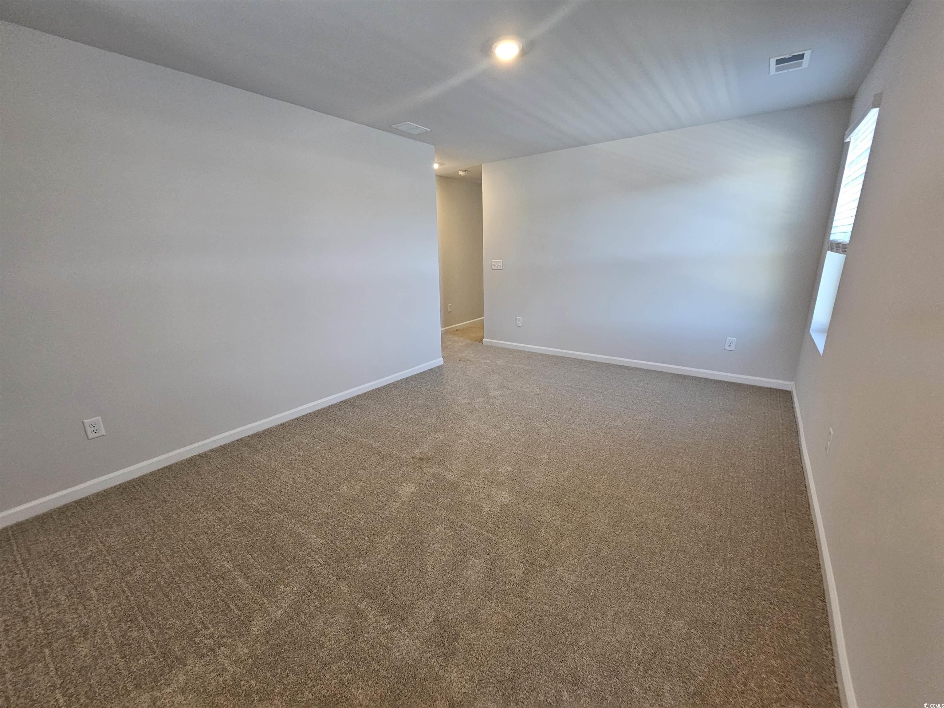 800 Wapama Street Little River, SC 29566 - Photo 18 of 34 Spare room featuring carpet and baseboards