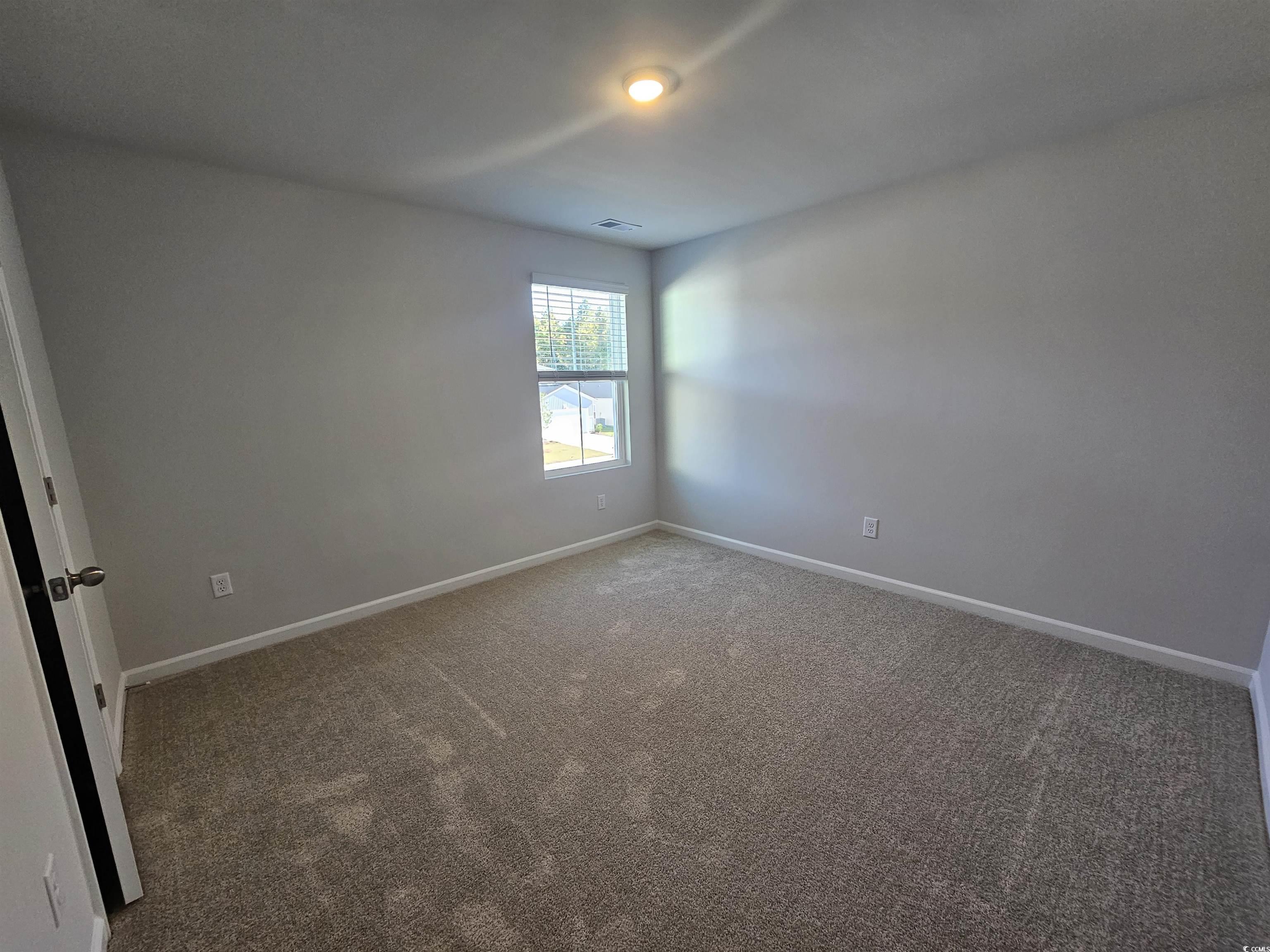 800 Wapama Street Little River, SC 29566 - Photo 19 of 34 Empty room featuring carpet floors and baseboards