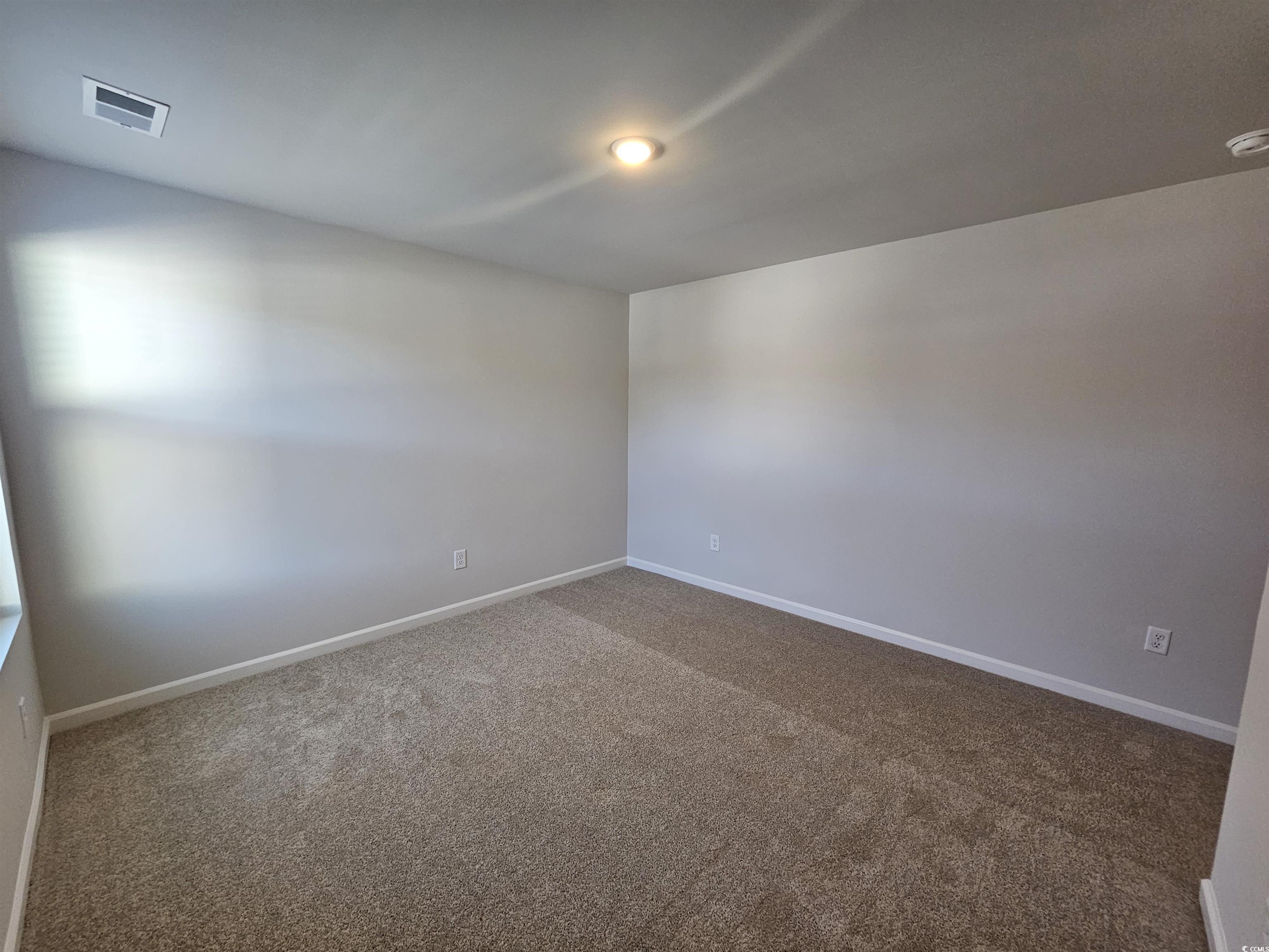 800 Wapama Street Little River, SC 29566 - Photo 21 of 34 Unfurnished room featuring carpet flooring and baseboards