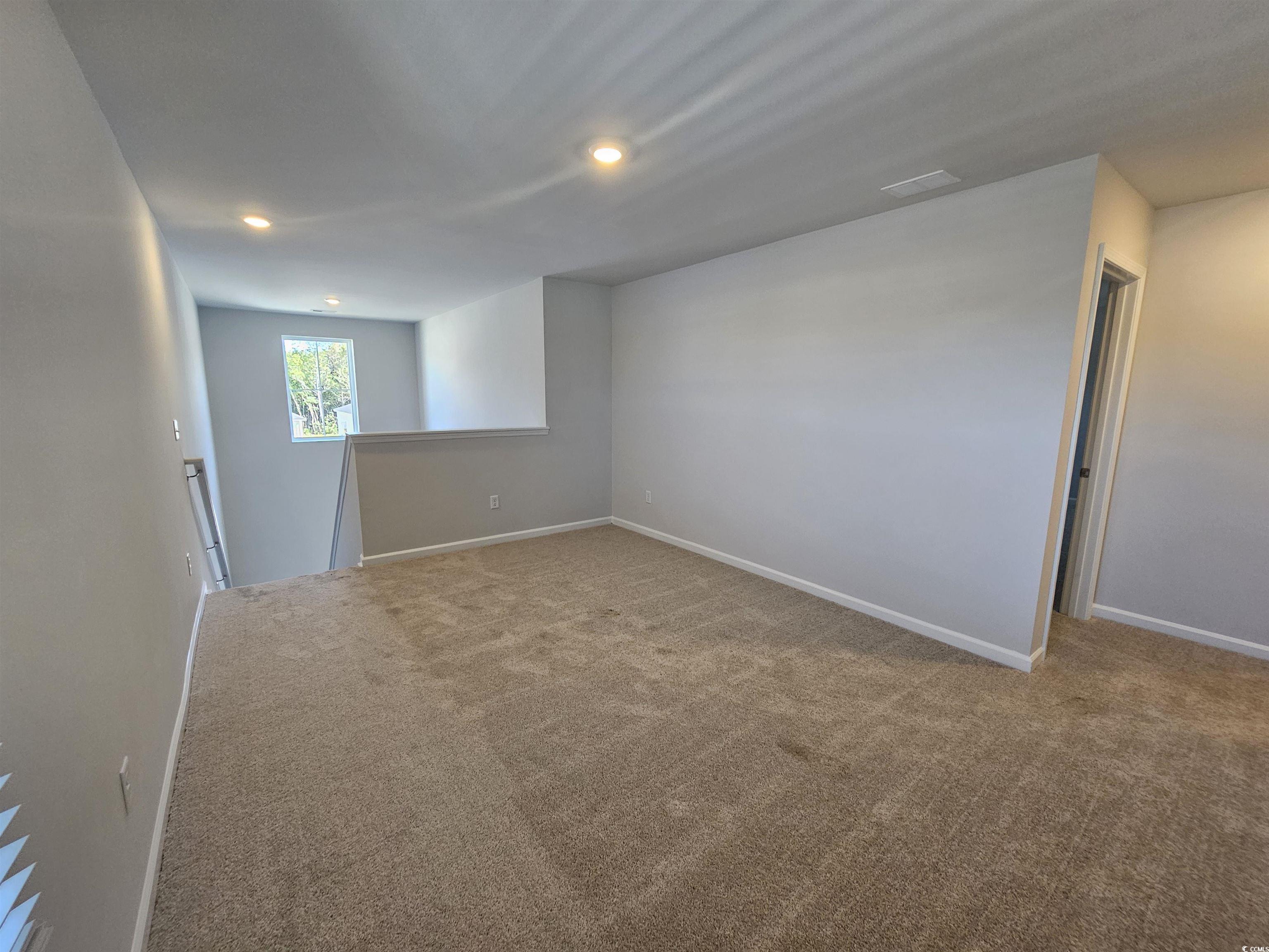 800 Wapama Street Little River, SC 29566 - Photo 27 of 34 Empty room featuring carpet flooring and recessed lighting