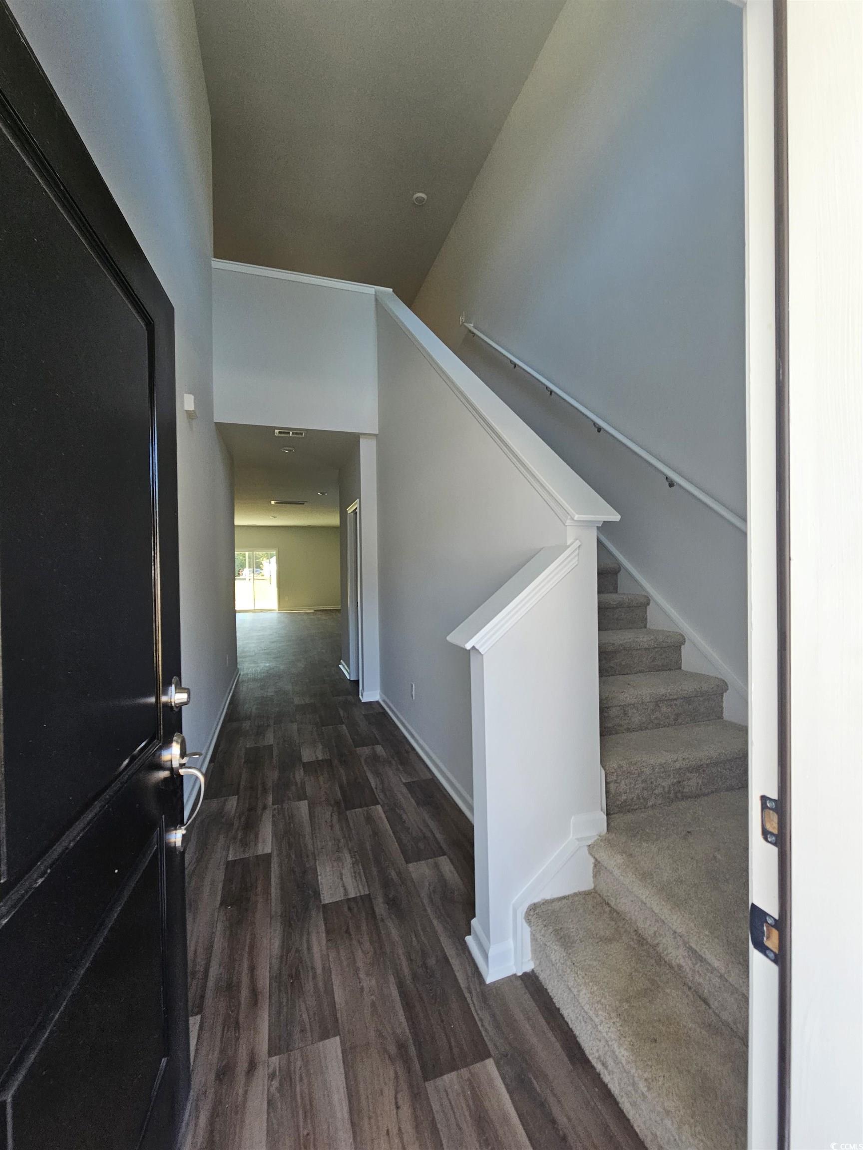 800 Wapama Street Little River, SC 29566 - Photo 4 of 34 Stairway featuring wood finished floors and baseboards