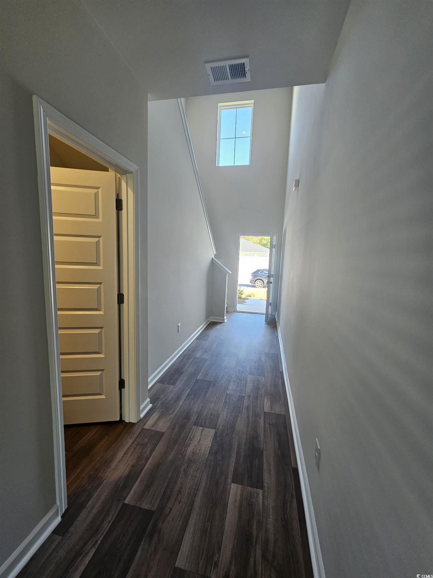 800 Wapama Street Little River, SC 29566 - Photo 10 of 34 Hall featuring dark wood finished floors and a towering ceiling