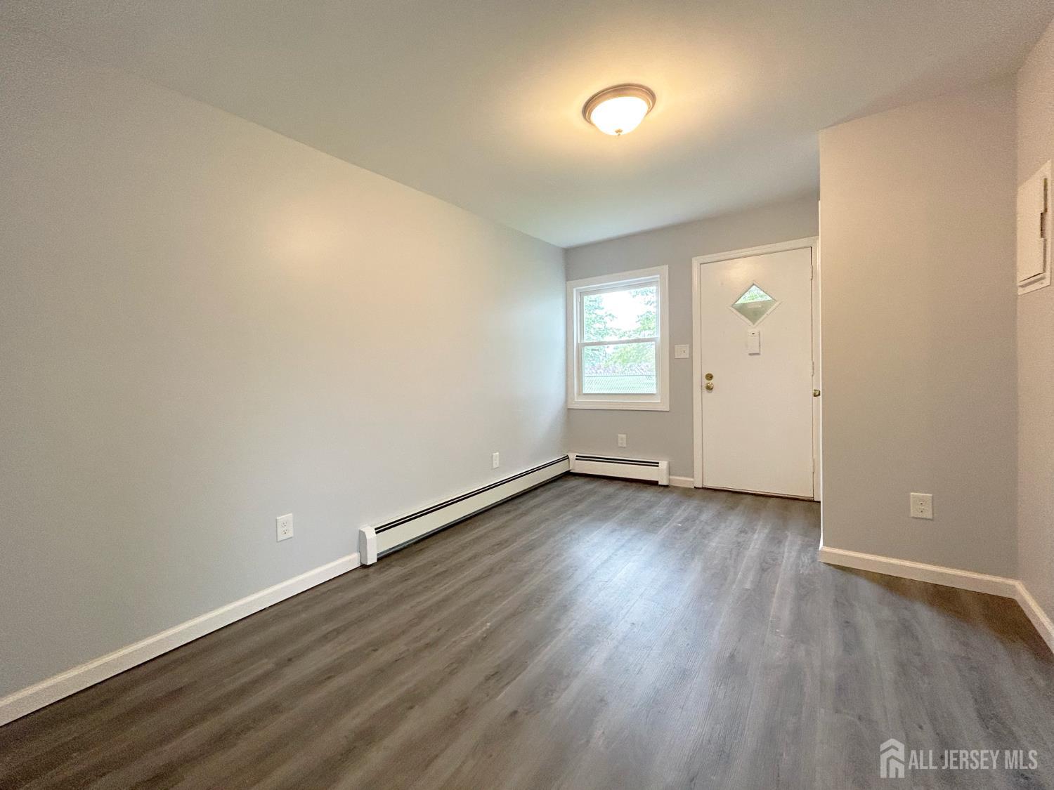 3 Stiles Road Edison, NJ 08817 - Photo 18 of 21 a view of a room with wooden floor and window