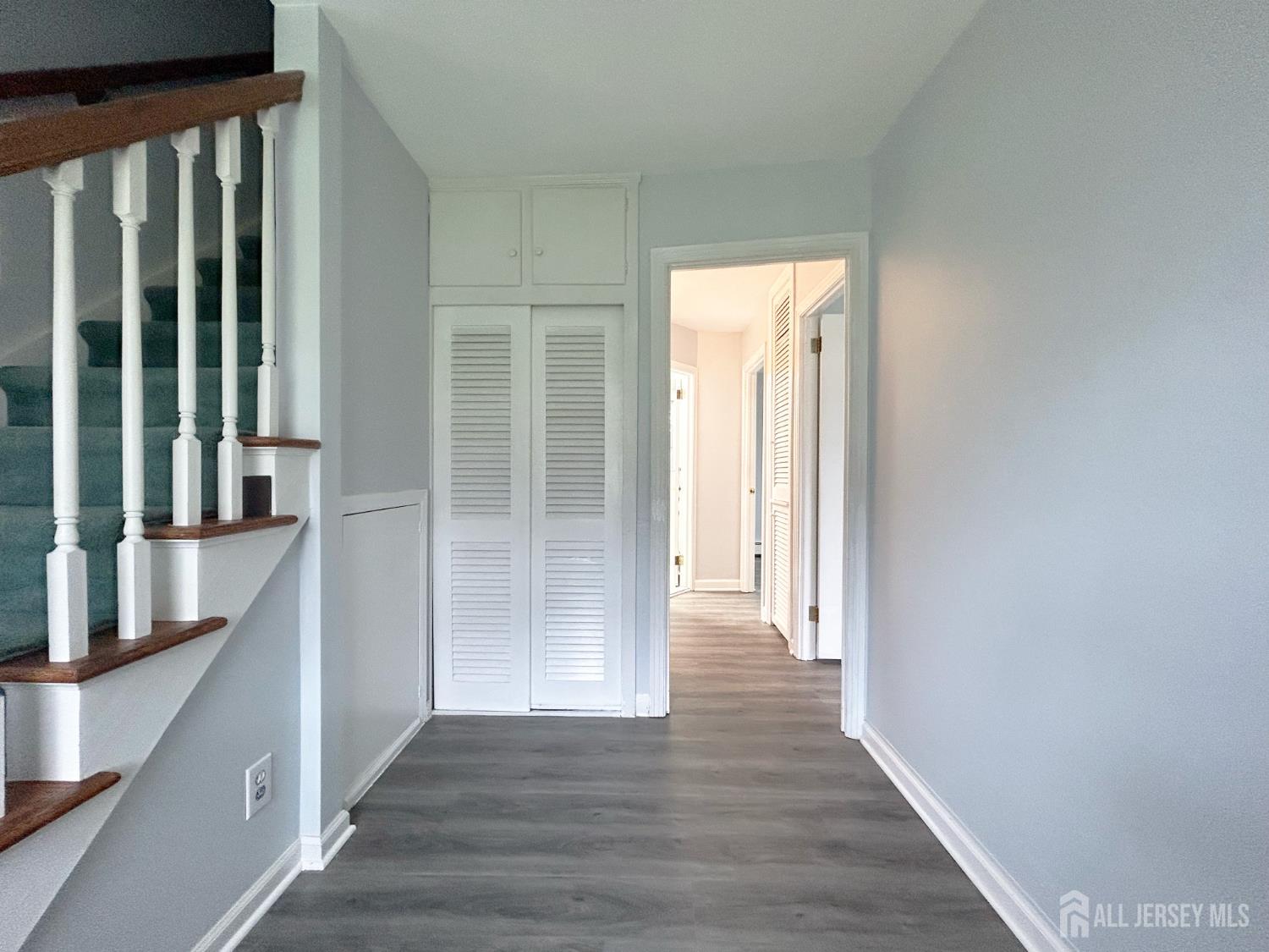 3 Stiles Road Edison, NJ 08817 - Photo 7 of 21 a view of a hallway with wooden floor and entryway