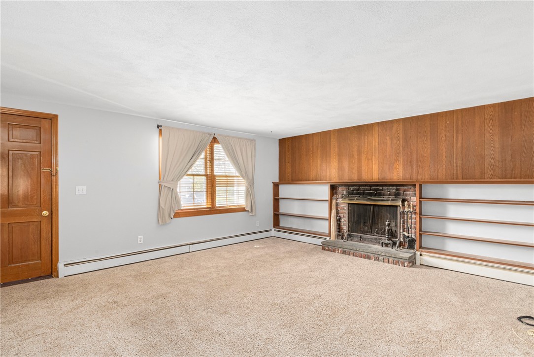33 Scarborough Road Cumberland, RI 02864 - Photo 7 of 25 Living room with Brick Fireplace
