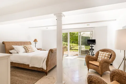 a bedroom with a bed and a couch