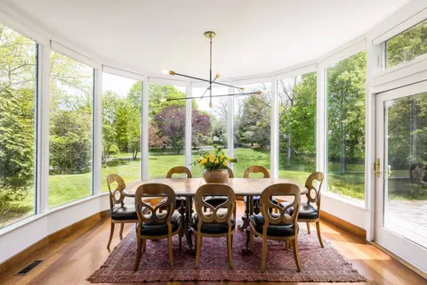 a view of a dining room with furniture window and outside view