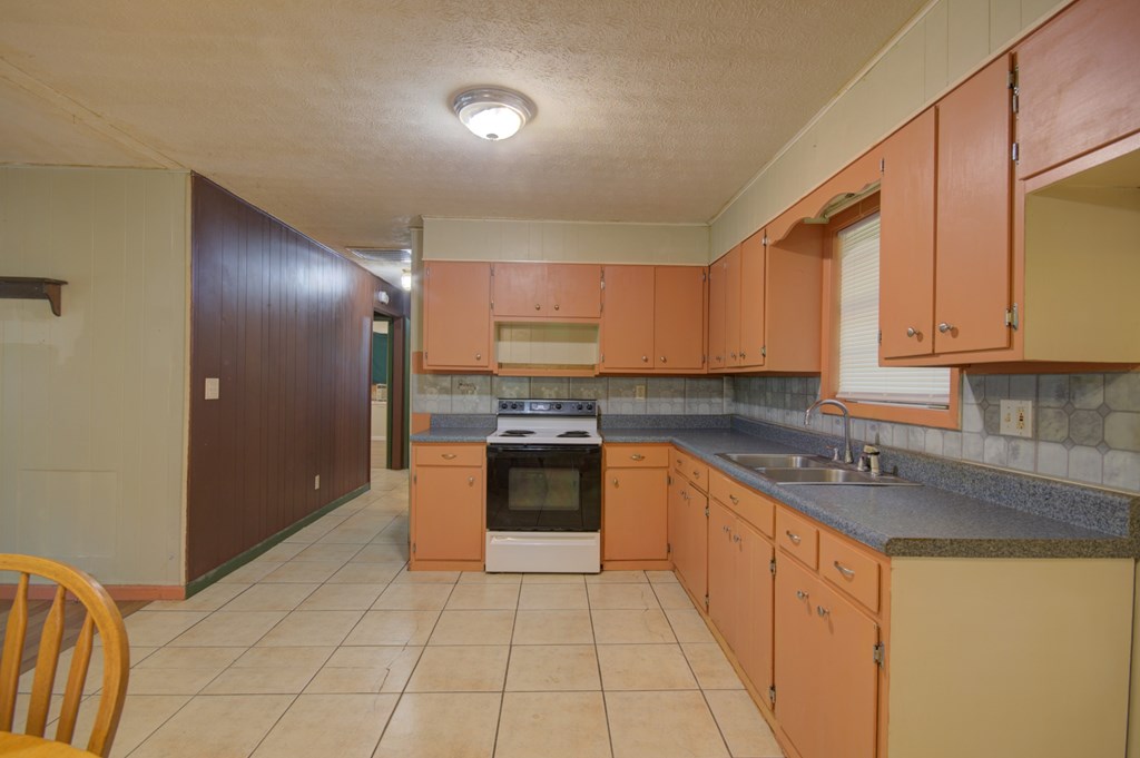 92 No-Where Road Blairsville, GA 30512 - Photo 6 of 36 a kitchen with stainless steel appliances granite countertop a refrigerator sink and cabinets