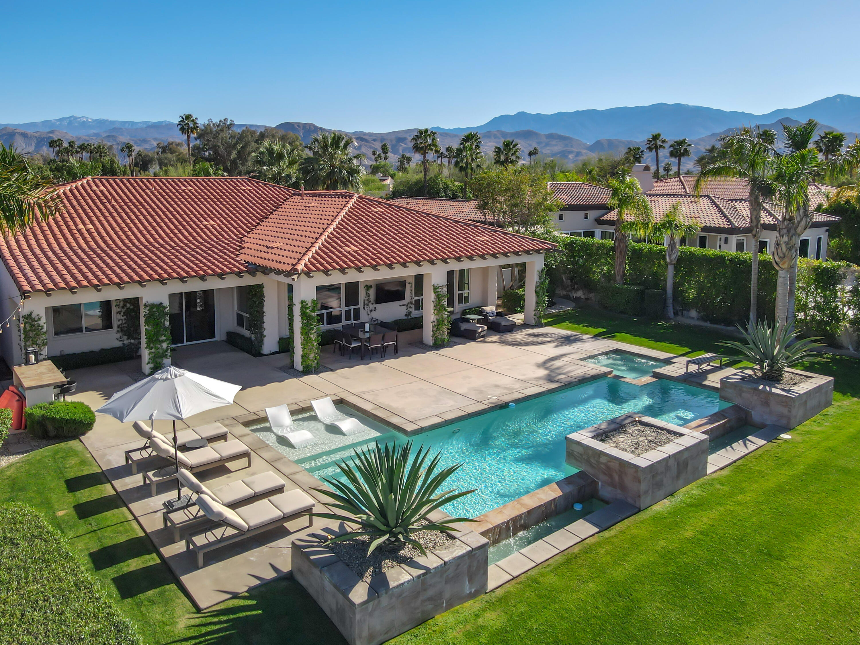 362 Loch Lomond Road Rancho Mirage, CA 92270 - Photo 3 of 26 a view of a patio with table and chairs with wooden floor and fence