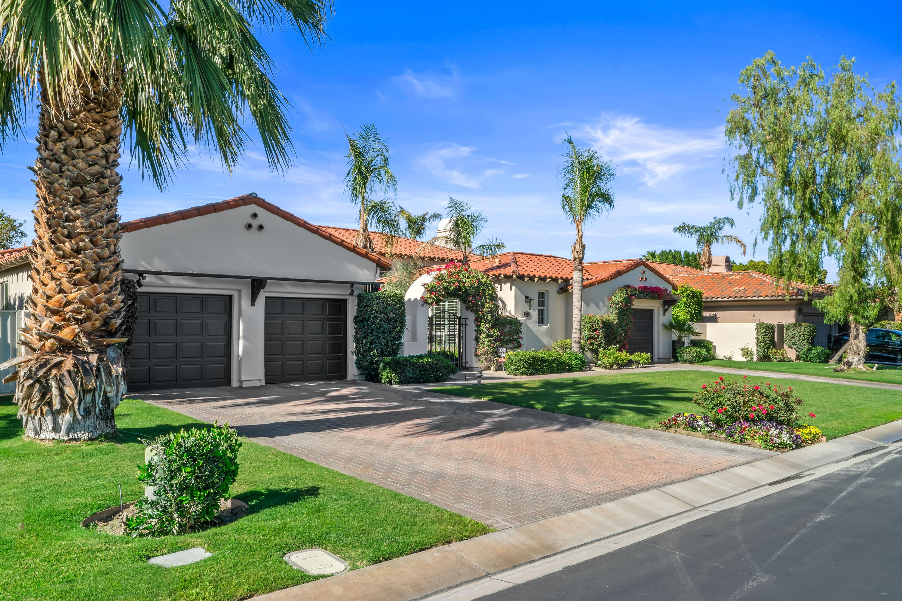 362 Loch Lomond Road Rancho Mirage, CA 92270 - Photo 7 of 26 a front view of house with yard and green space