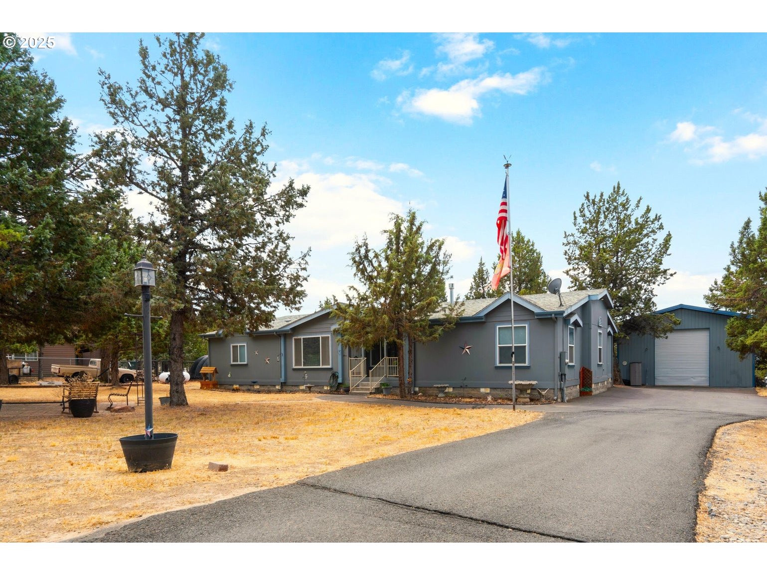 12844 Southwest Upper Ridge Terrebonne, OR 97760 - Photo 1 of 25 a front view of a house with a yard