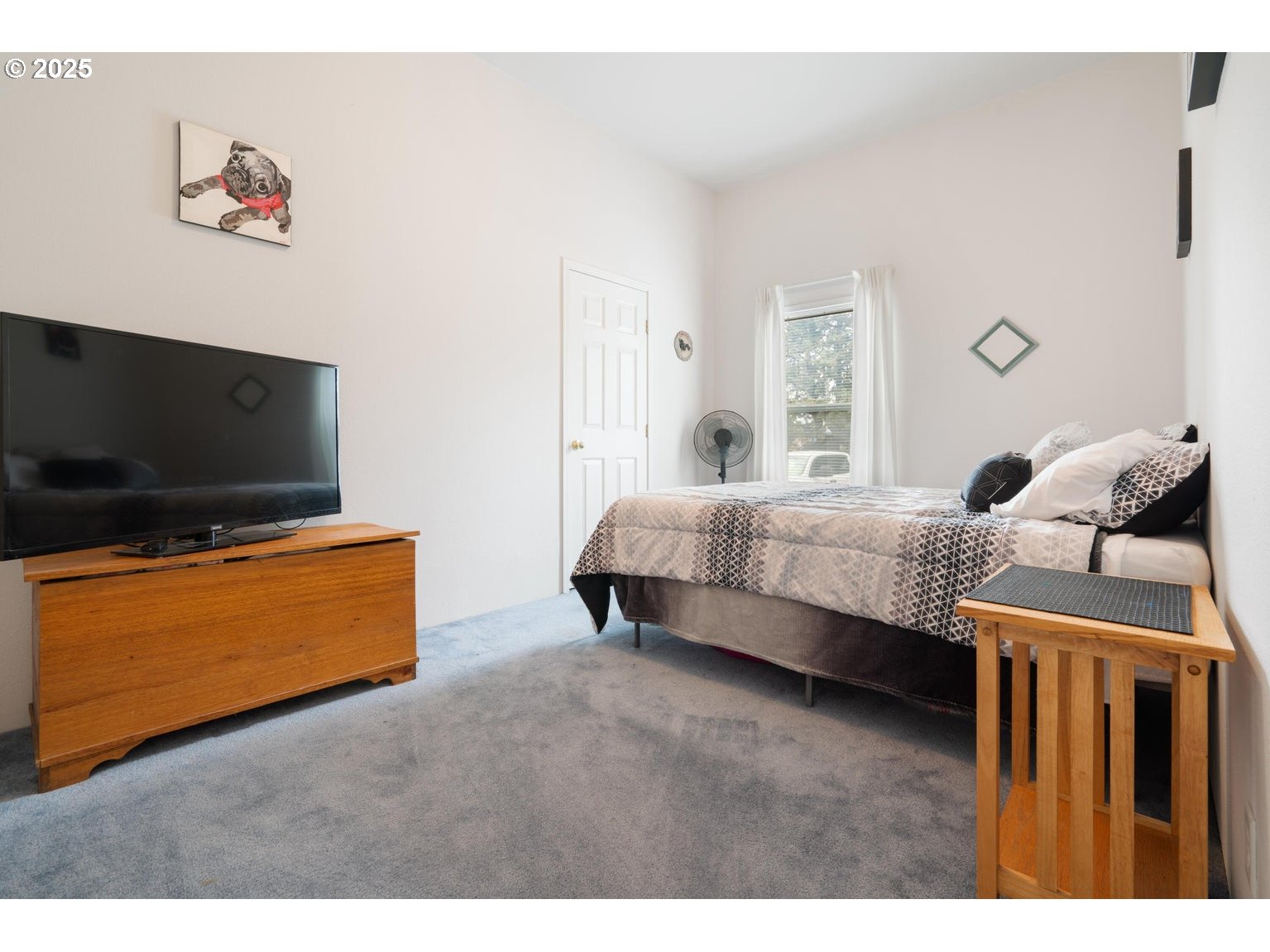 12844 Southwest Upper Ridge Terrebonne, OR 97760 - Photo 13 of 25 a bedroom with a bed and a flat screen tv
