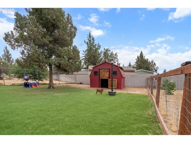 a view of a yard with a house and a sitting area