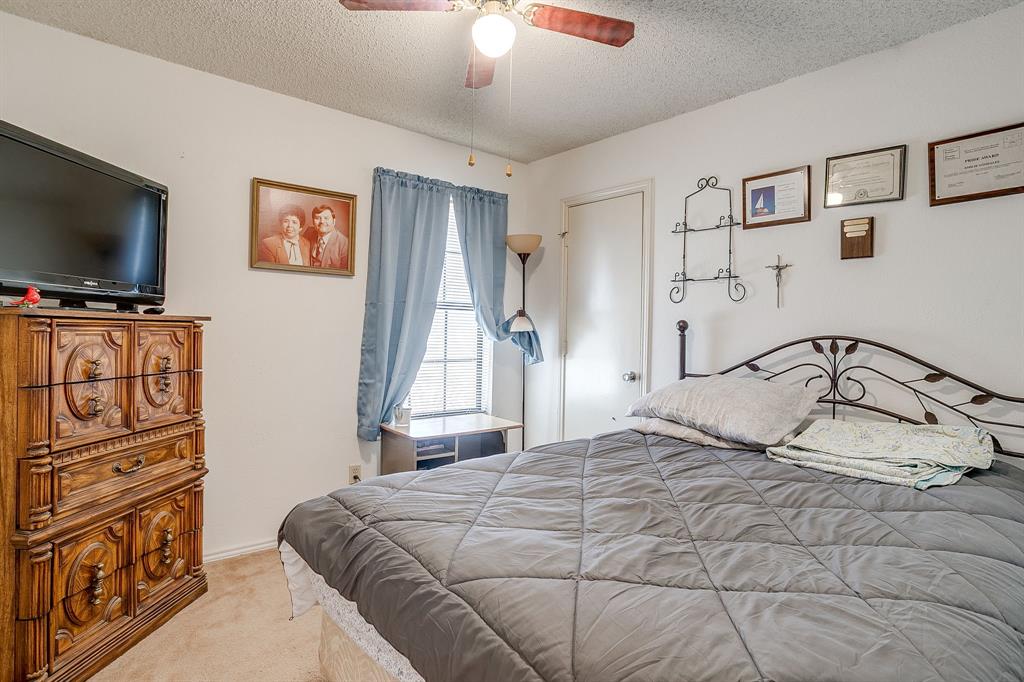 3019 Sunrise Trail Weatherford, TX 76088 - Photo 23 of 40 a bedroom with a bed and a flat screen tv