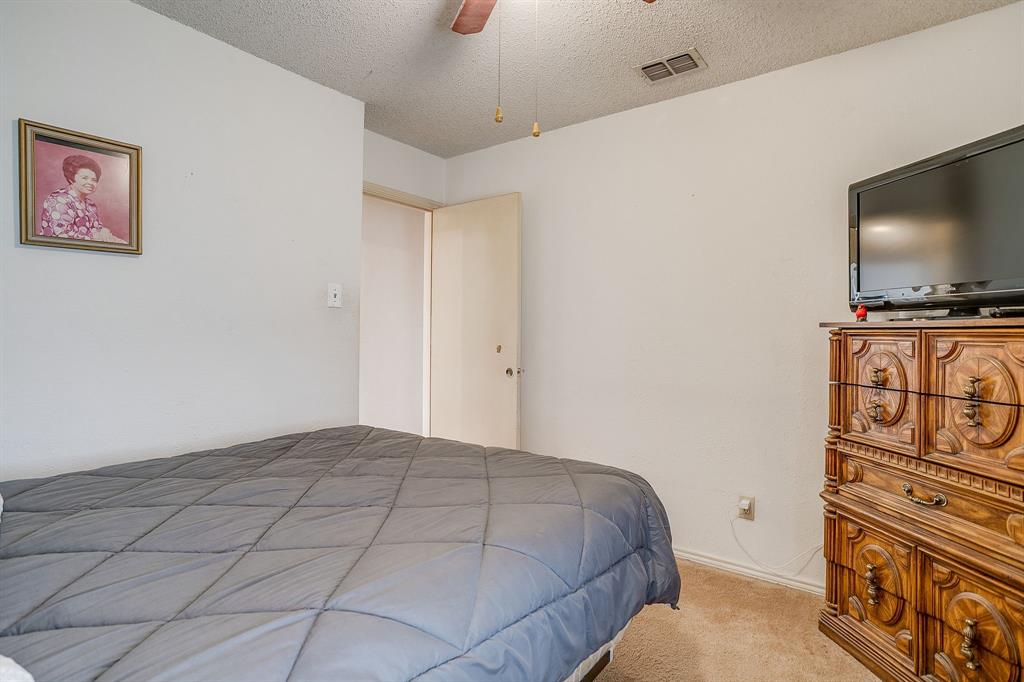3019 Sunrise Trail Weatherford, TX 76088 - Photo 24 of 40 a bedroom with a bed and a flat screen tv