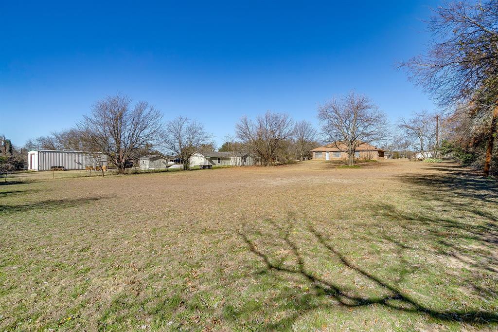 3019 Sunrise Trail Weatherford, TX 76088 - Photo 33 of 40 a view of dirt yard with a large tree