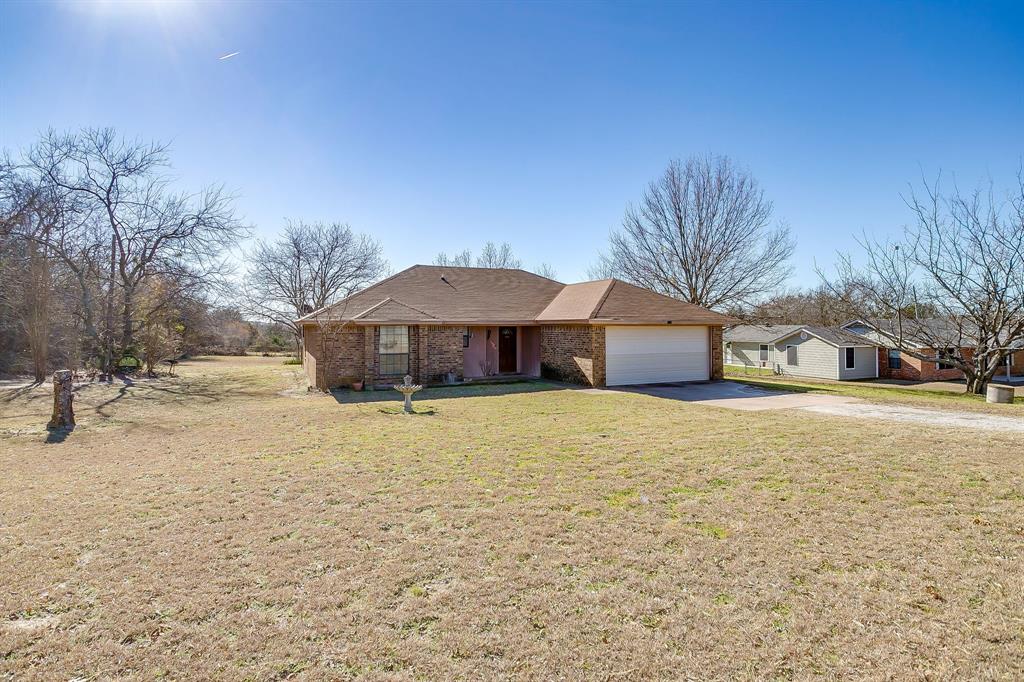3019 Sunrise Trail Weatherford, TX 76088 - Photo 40 of 40 a front view of house with yard covered with trees