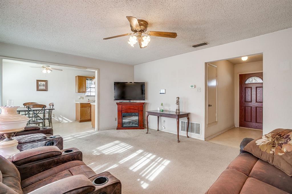 3019 Sunrise Trail Weatherford, TX 76088 - Photo 7 of 40 a living room with furniture and a flat screen tv