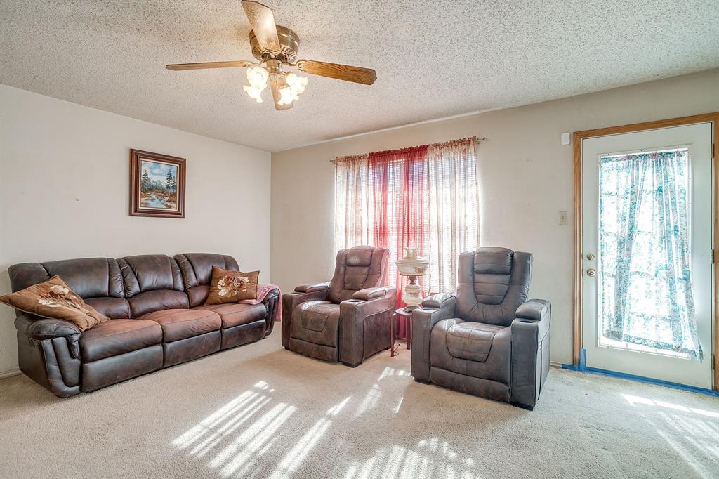 3019 Sunrise Trail Weatherford, TX 76088 - Photo 9 of 40 a living room with furniture and a window
