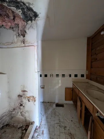 a kitchen with a sink and cabinets